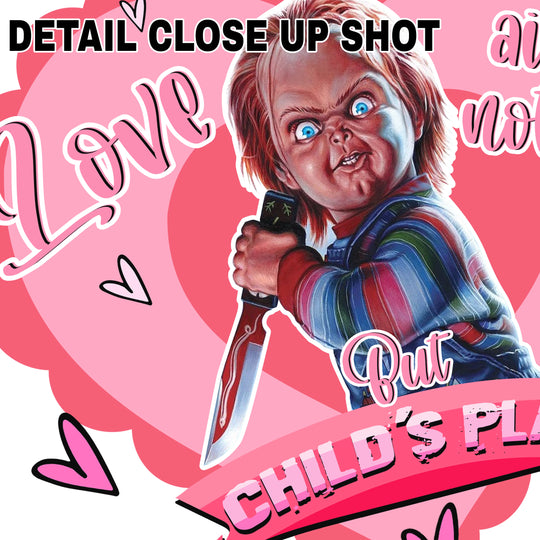 Valentine DTF transfer design featuring Chucky character with knife and pink heart background with Love Ain't Nothin But Child's Play text