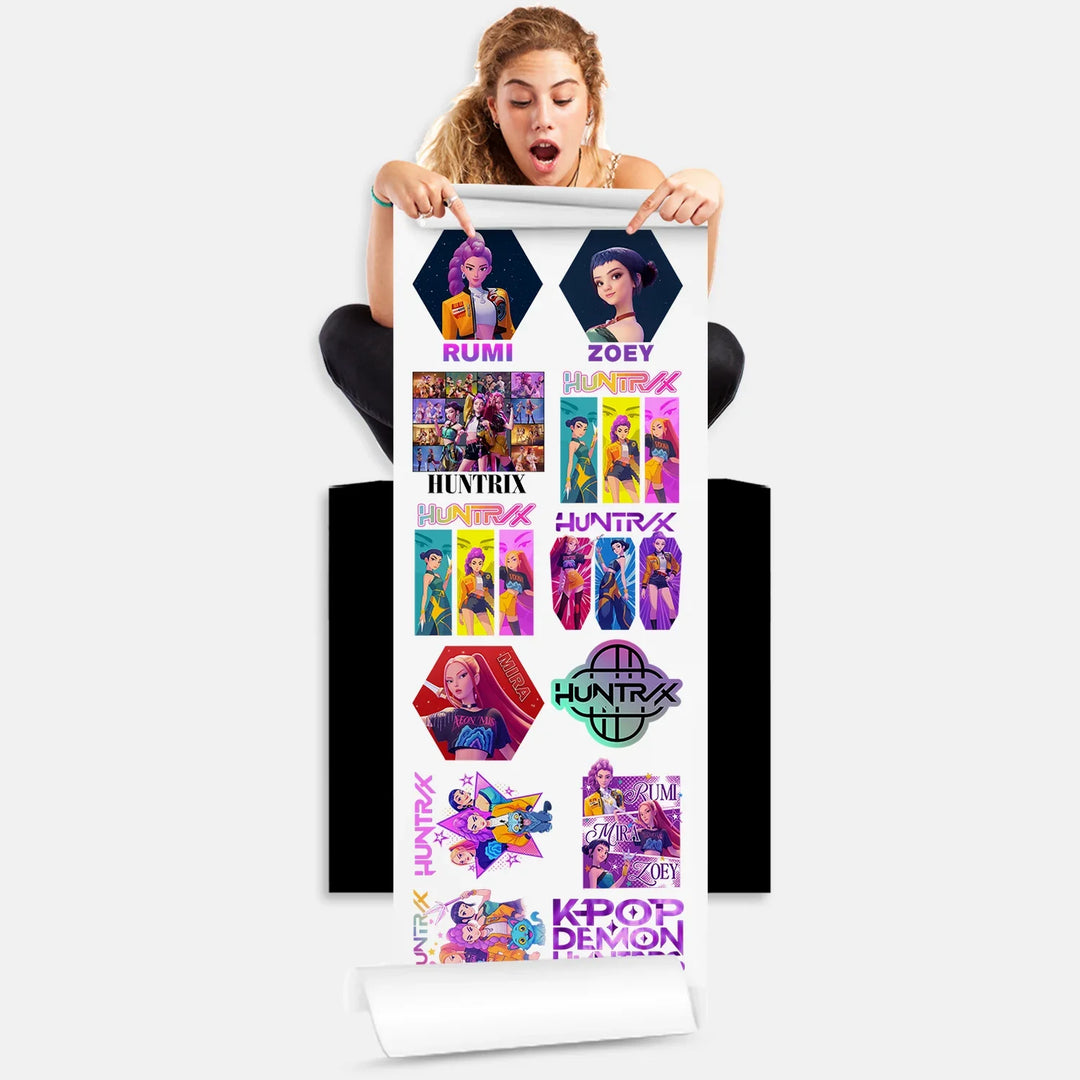 Person holding Huntrix Kpop Demon Hunters DTF Transfers gang sheet with 12 anime character transfers ready to press