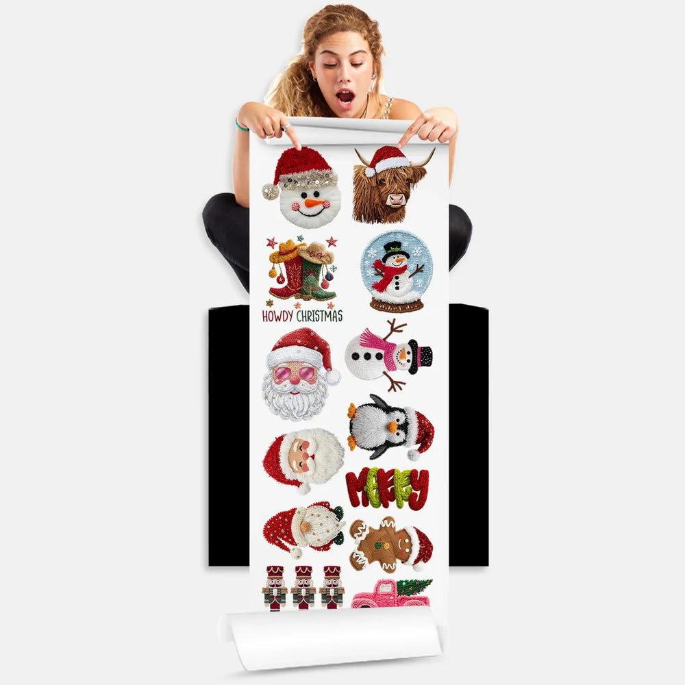 Person holding Christmas DTF gang sheet with 11 cozy yarn stitched Santa, snowman and holiday character designs