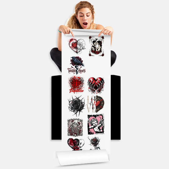 Person holding Valentine tattoo hearts DTF gang sheet with 12 gothic romantic designs ready for heat press application
