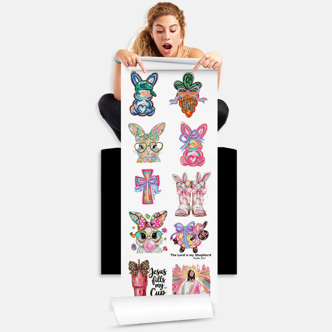 Person holding Easter watercolor bunny faith DTF transfer gang sheet with 10 colorful designs ready to press
