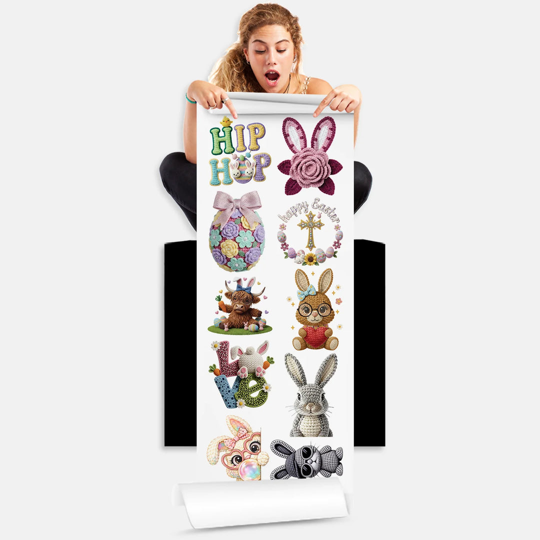 Person holding Easter DTF transfer gang sheet with 10 crochet yarn style bunny and egg designs ready to press on clothing