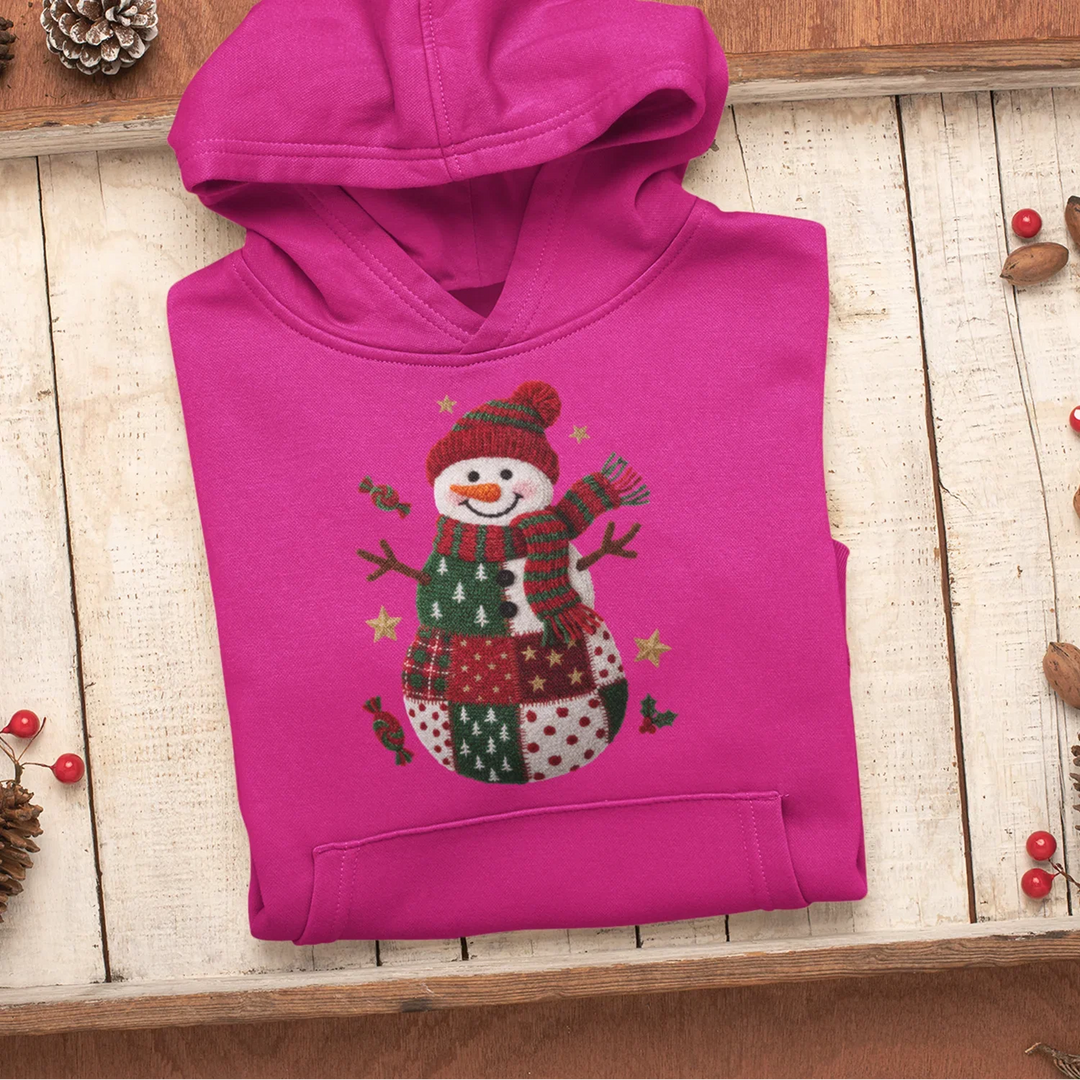 Holiday DTF transfer applied to white t-shirt showing cute knitted snowman with pom-pom hat and striped scarf design
