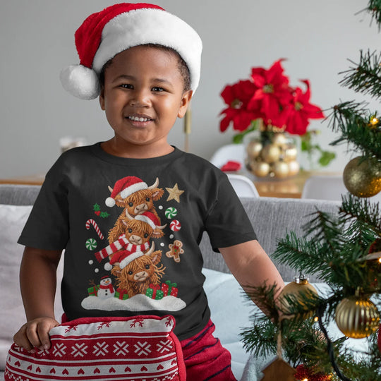 Christmas Highland cows DTF transfer applied on red holiday sweatshirt showing vibrant colors and professional quality