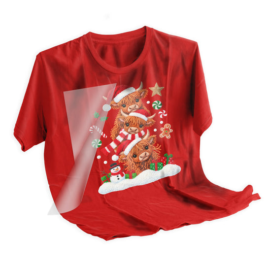 Step-by-step application of Highland cow Christmas DTF transfer using heat press showing professional installation process