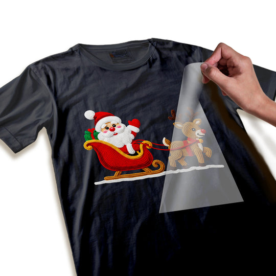 Close-up detail of embroidered-style Santa and reindeer DTF transfer showing rich colors and textured finish quality