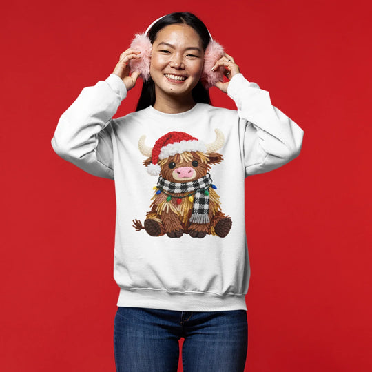 Christmas highland cow DTF transfer applied to black t-shirt showing premium quality holiday apparel design