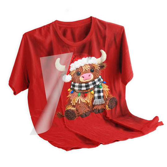 Step-by-step application of Christmas highland cow DTF transfer using heat press for professional results