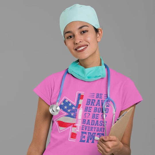 EMT apparel mockup showing Be Brave Bold Badass DTF transfer applied to medical professional uniform shirt