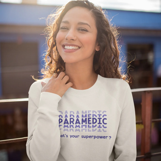 Person wearing shirt with paramedic superpower DTF transfer design showing appreciation for first responders and EMTs