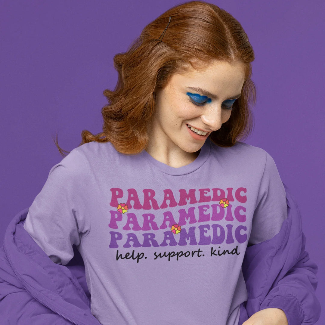 EMS paramedic DTF transfer applied to black t-shirt showing help support kind message in vibrant purple gradient text
