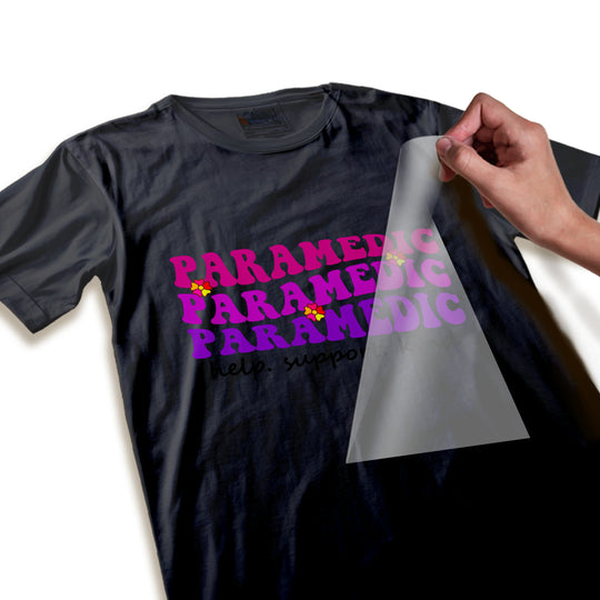 Close-up detail view of paramedic DTF transfer showing crisp purple gradient text quality and decorative star elements
