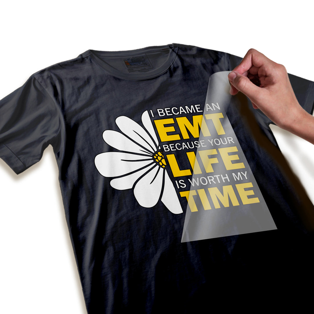 Close-up detail of EMT DTF transfer showing high-quality yellow text and white daisy petals ready to press