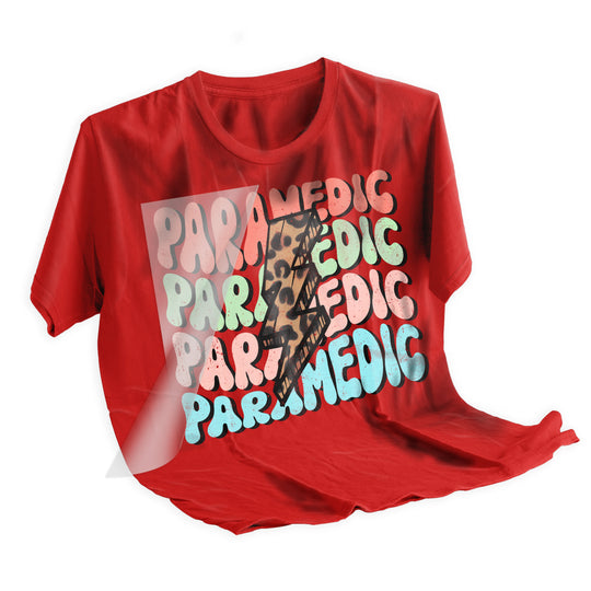 Applied paramedic groovy DTF transfer on dark t-shirt showing vibrant wavy text design after heat pressing