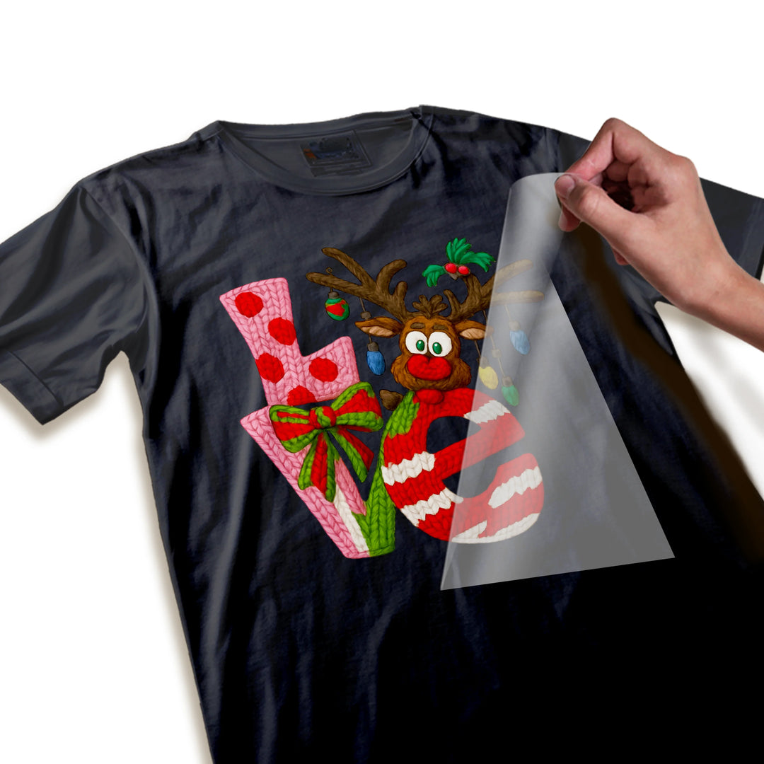 Close-up detail of Christmas DTF transfer showing high-quality reindeer design with ornament and text elements