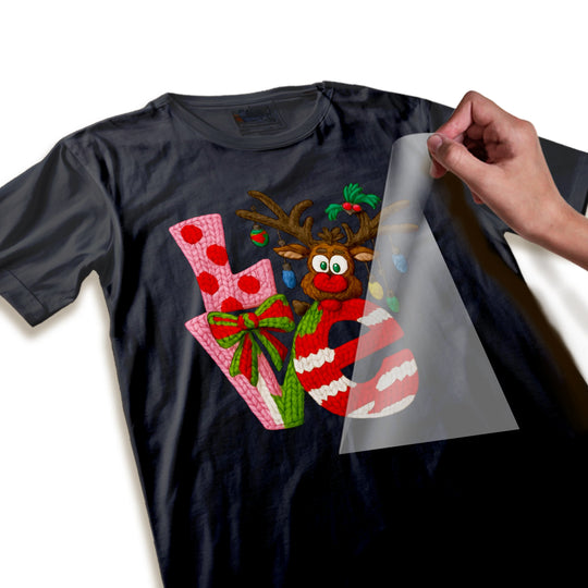 Close-up detail of Christmas DTF transfer showing high-quality reindeer design with ornament and text elements