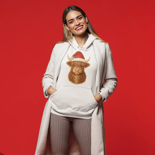 Model wearing Christmas t-shirt with Highland cow Santa hat DTF transfer design showcasing festive holiday style
