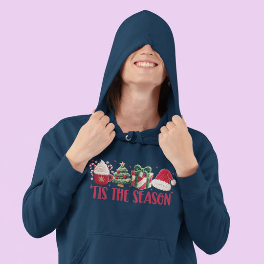 Person wearing Christmas t-shirt with Tis The Season DTF transfer design for holiday apparel inspiration