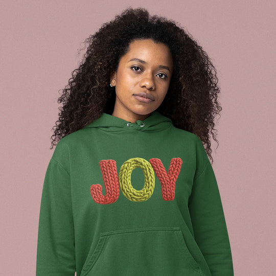 Model wearing Christmas Joy DTF transfer on festive holiday shirt showing knitted rope lettering application results