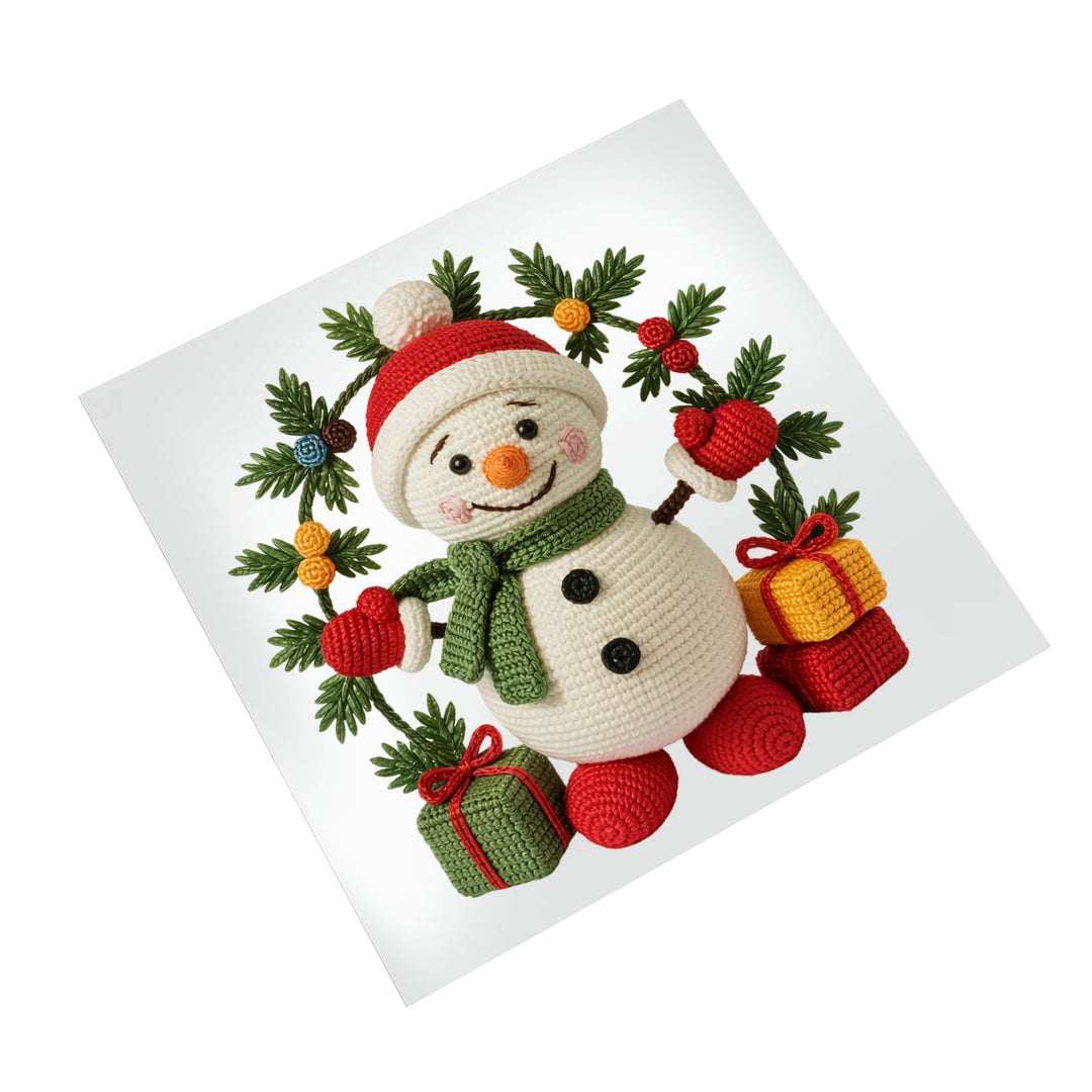 Christmas DTF transfer featuring adorable crocheted snowman in Santa hat surrounded by evergreen wreath with colorful ornaments