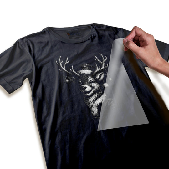 Close-up detail of Christmas reindeer DTF transfer showing intricate halftone texturing, cross-hatching artwork, and hanging ornament elements