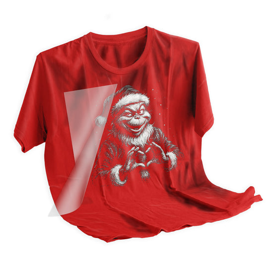 Christmas Mean Green Guy halftone DTF transfer applied to dark colored t-shirt showing final pressed result with vintage aesthetic