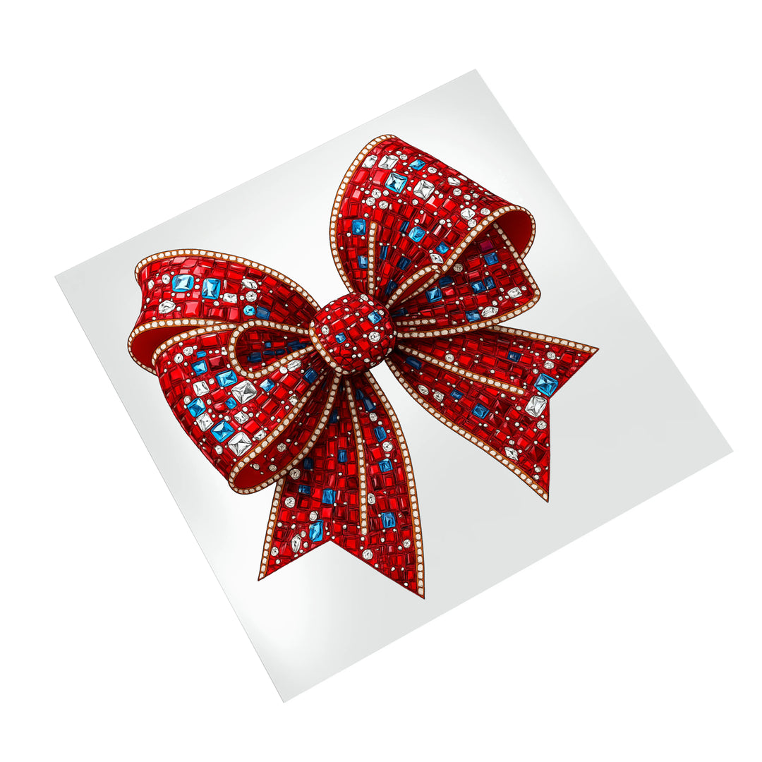 Red and blue rhinestone Christmas bow DTF transfer design displayed on white background showing crystal details