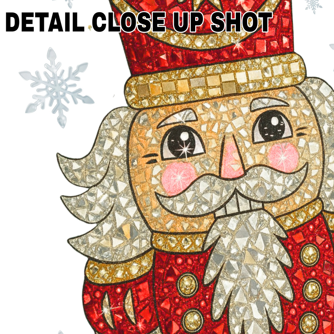 Rhinestone nutcracker Christmas DTF transfer with sparkling red hat, golden details, and intricate mosaic pattern on white background