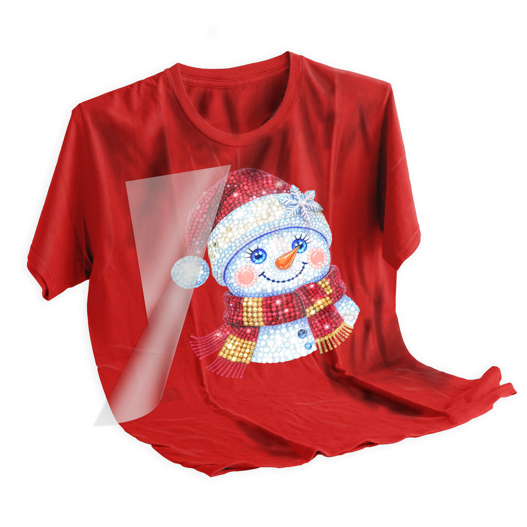 Heat press application of rhinestone Christmas snowman DTF transfer being applied to holiday shirt