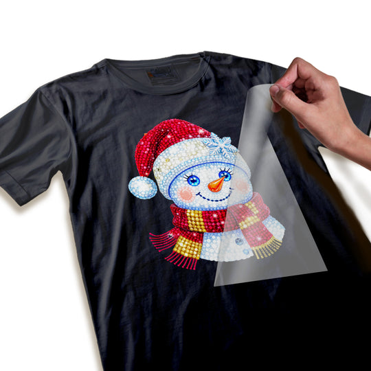 Close-up detail of rhinestone sparkle texture and crystalline effects on Christmas snowman DTF transfer design