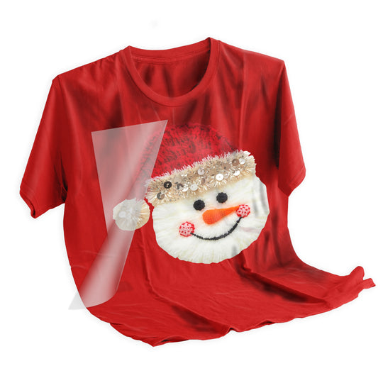 Christmas snowman DTF transfer applied to dark colored t-shirt showing vibrant holiday colors and professional heat press application