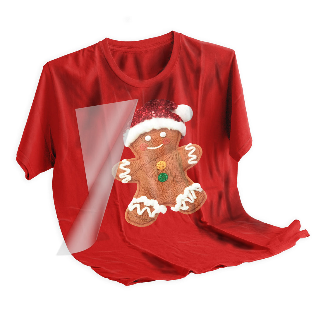 Christmas gingerbread Santa DTF transfer applied to dark fabric showing professional heat press application and vivid color transfer results