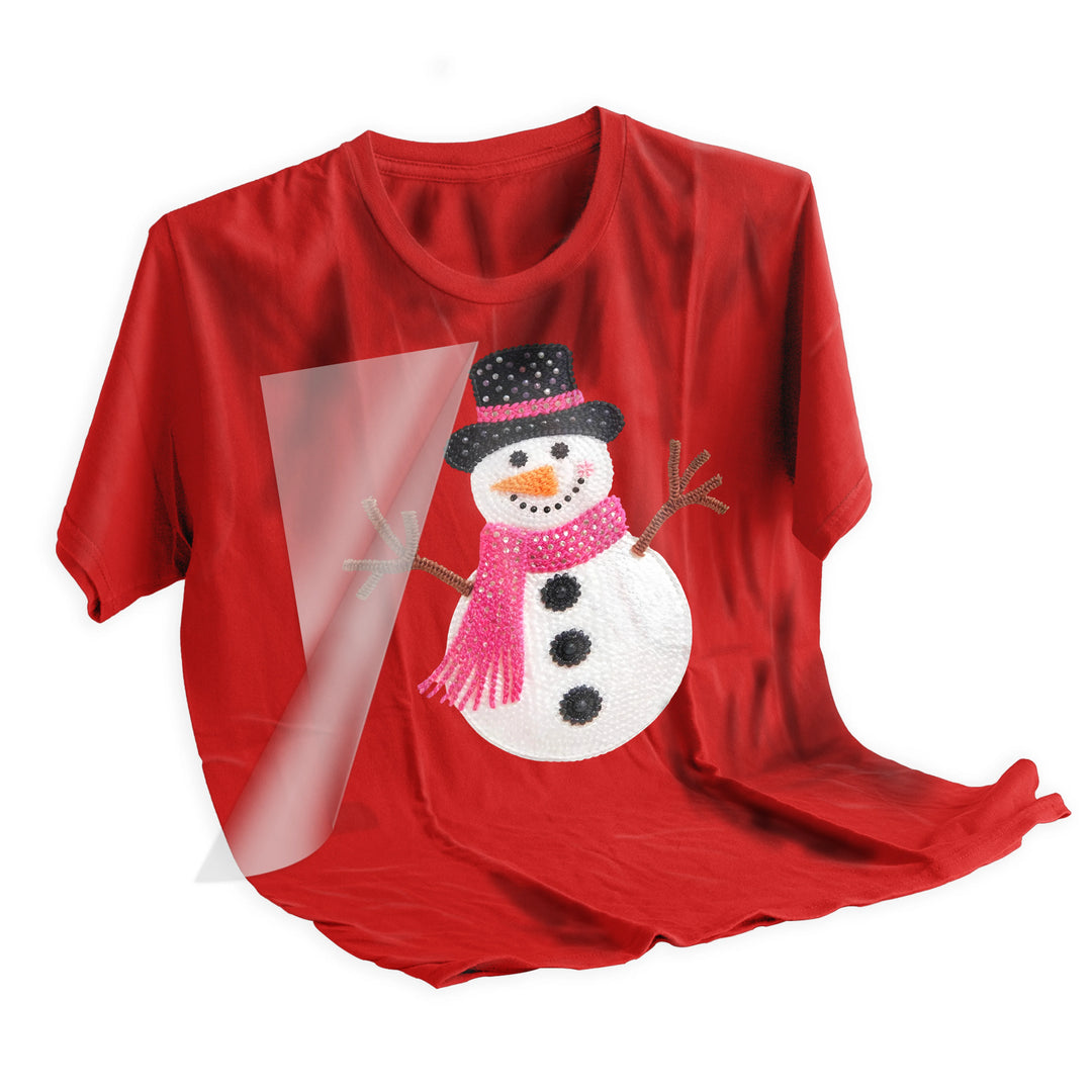 Christmas snowman DTF transfer applied to red holiday shirt showing final pressed result