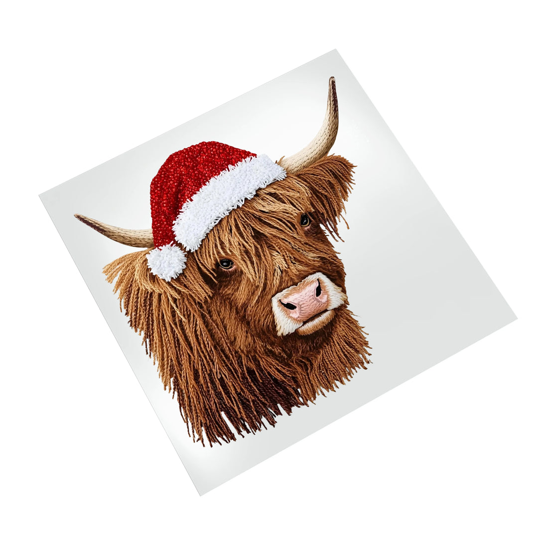 Highland cow Christmas DTF transfer with Santa hat displayed on clean white background showing full design details