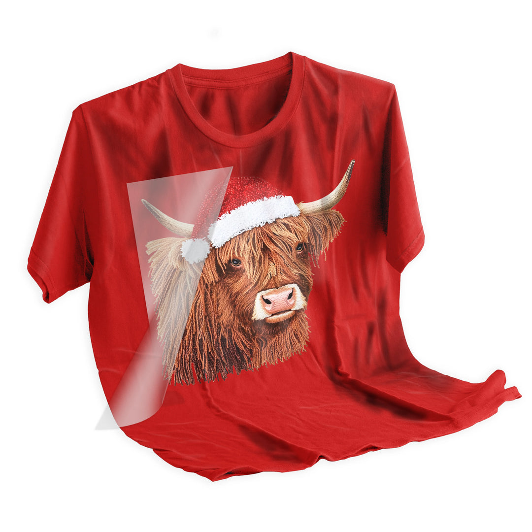 Highland cow Christmas DTF transfer applied to dark colored t-shirt showing final pressed result