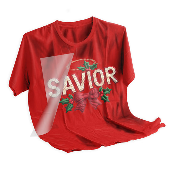 Christmas SAVIOR DTF transfer heat pressed onto dark colored t-shirt showing final application result with textured knit appearance