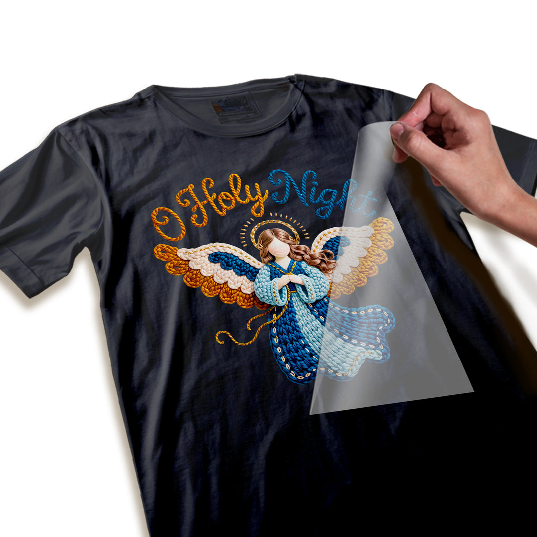 Close-up detail of Christmas angel DTF transfer showing intricate wing feathers, flowing dress fabric texture, and rope-style lettering craftsmanship