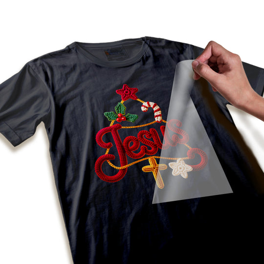 Close-up detail view of Christmas Jesus DTF transfer showing textured yarn-like lettering quality, dimensional appearance, and intricate holiday decorative elements