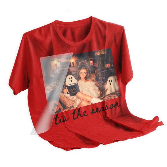 Heat press application of Halloween Retro Doll Tis The Season DTF transfer onto a dark t-shirt using a heat press machine at 310 degrees Fahrenheit for 15 seconds