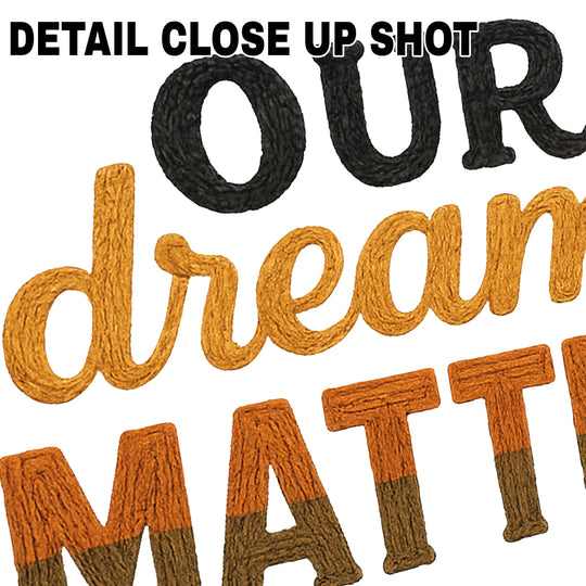Our Dreams Matter DTF transfer design with textured yarn-style lettering in orange gradient and bold black text on white background