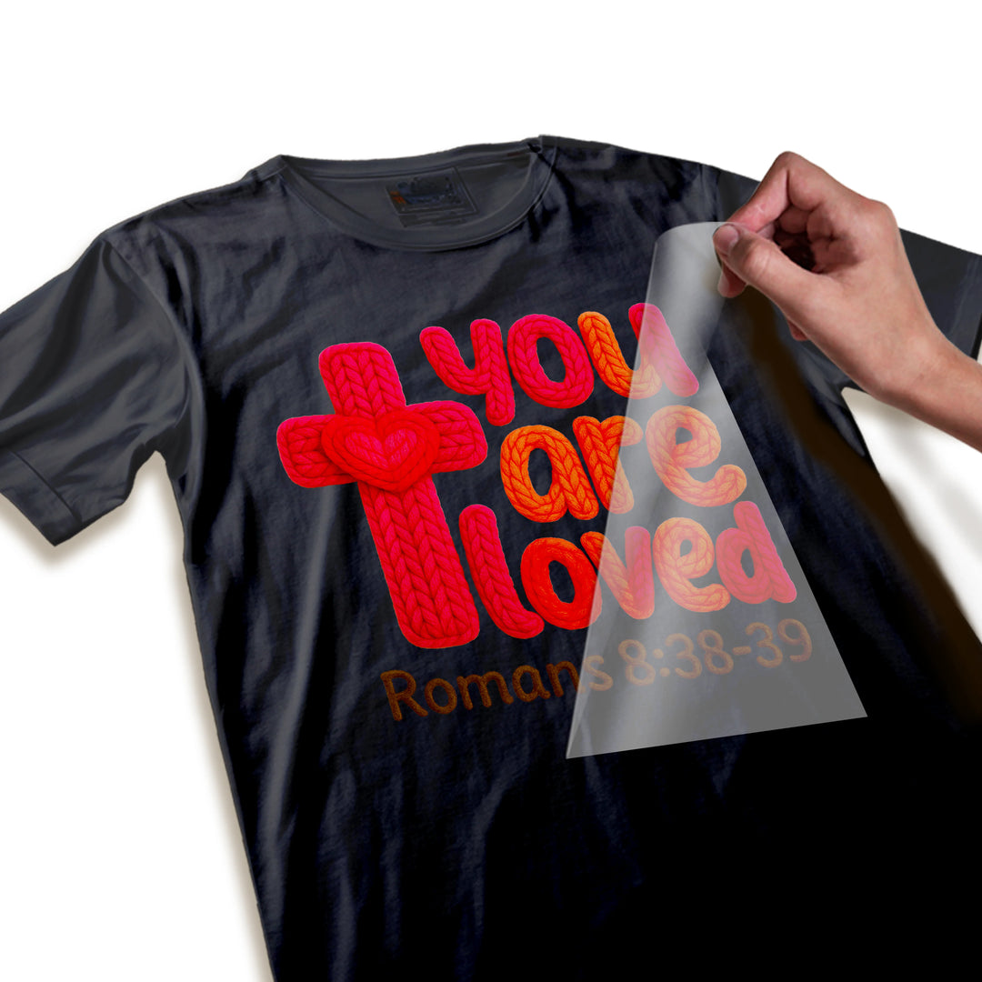 Close-up detail of You Are Loved DTF transfer showing braided rope texture and dimensional knitted appearance of letters and cross