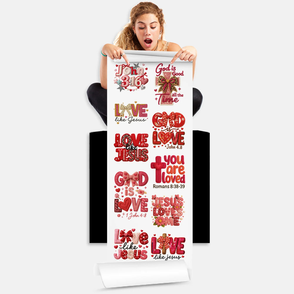 Person holding Valentine's Christian love DTF transfer gang sheet with 10 faith-based designs featuring biblical verses