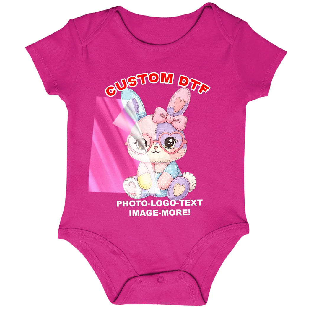 Custom DTF transfer applied to a pink baby onesie infant bodysuit showing a cute bunny design — ready-to-press full color transfer printed in USA by Mugsie, Agoura Hills CA