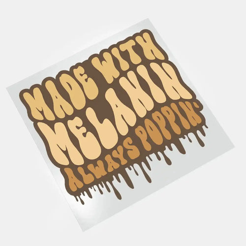 DTF print on film featuring the "Made with Melanin, Always Poppin" design. Perfect for creating vibrant and durable custom apparel with ready-to-press DTF transfers.





