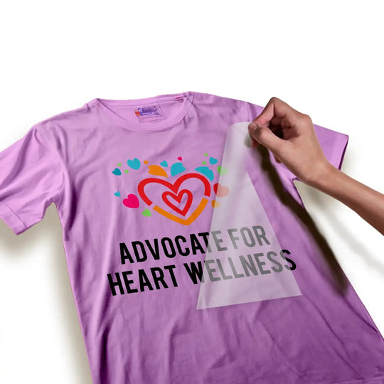 Heart wellness advocate DTF transfer being applied to purple shirt