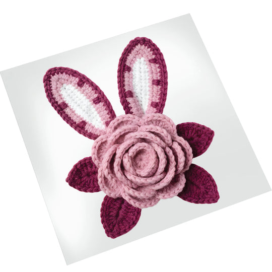 Easter bunny ears DTF transfer showing textured yarn-like appearance with dimensional pink flower on clean white backdrop for printing