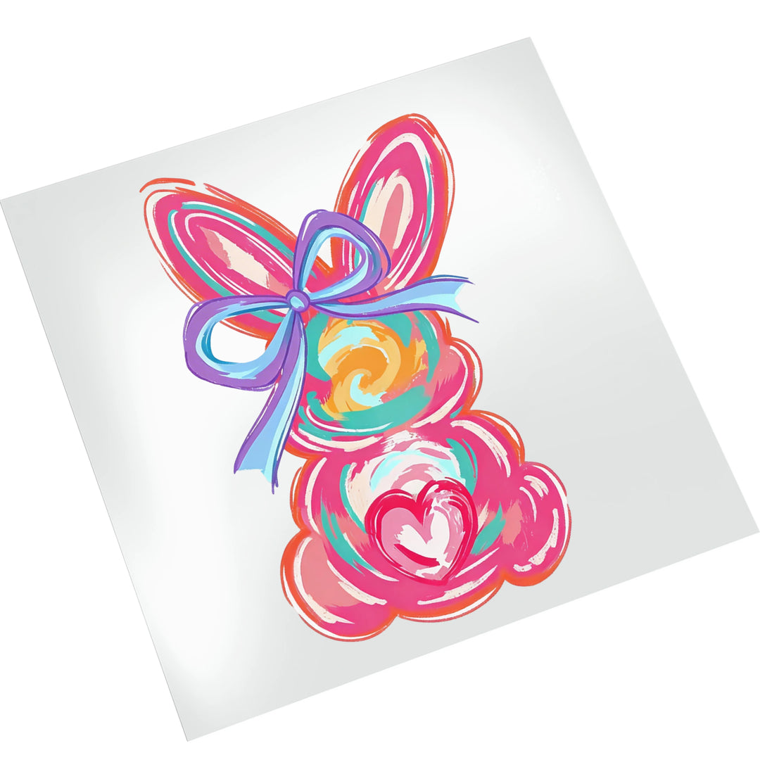 Easter bunny DTF transfer mockup showing vibrant watercolor bunny design with purple bow on white t-shirt background for size reference