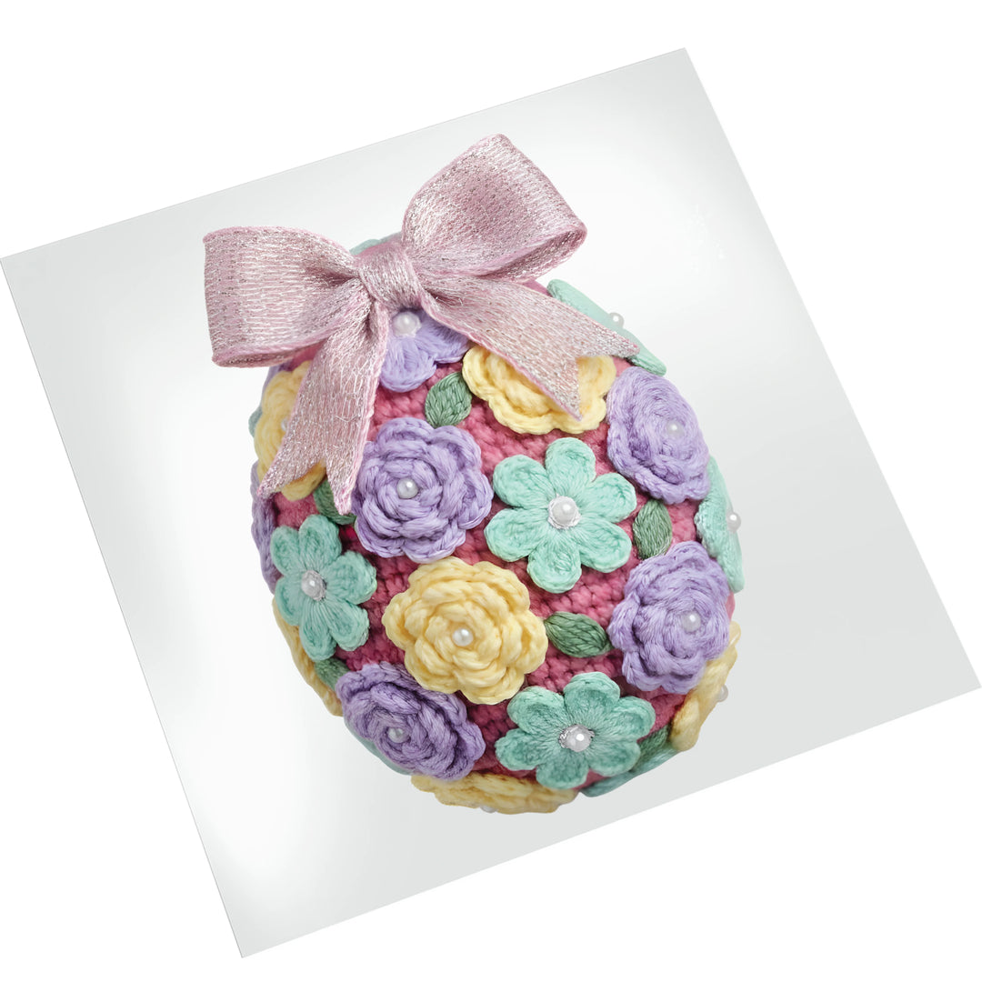 Crochet floral Easter egg DTF transfer on white background showing dimensional yarn-like texture with colorful spring flowers and metallic accents