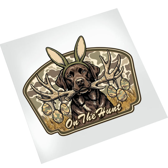 Easter hunting dog DTF transfer on white background showing chocolate lab with bunny ears, antlers, and camouflage elements ready to press