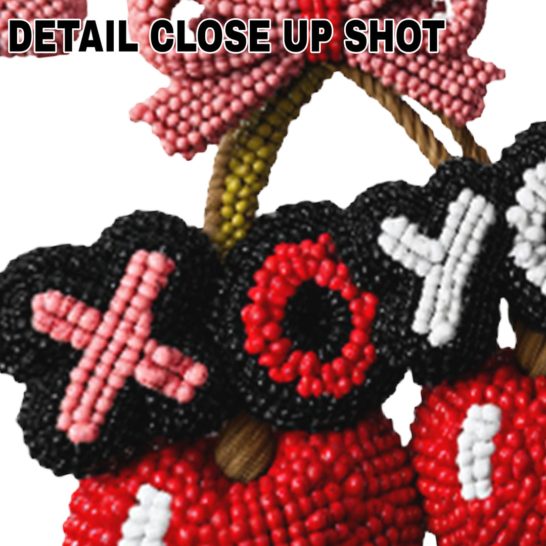 Valentine's DTF transfer design featuring textured red cherries with pink bow and scattered hearts spelling XOXO in knitted appearance style